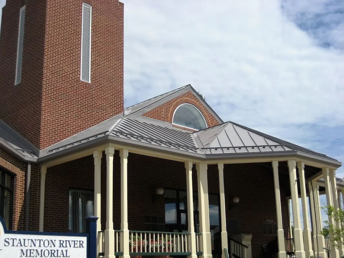 Skilled roofing craftsmen working on a residential roof in Greenville